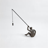 Reel It In sculpture(تمثال لصياد يحمل صنارة)